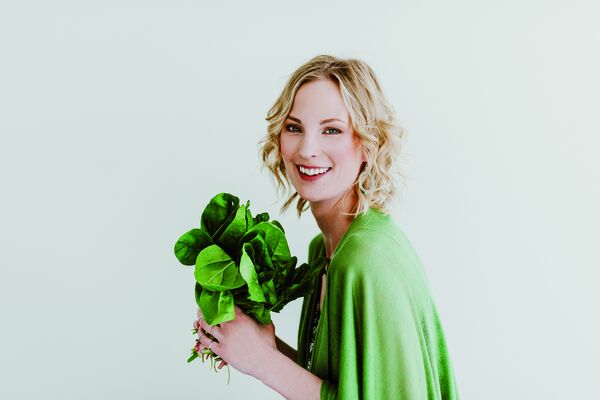 Young woman with fresh spinach